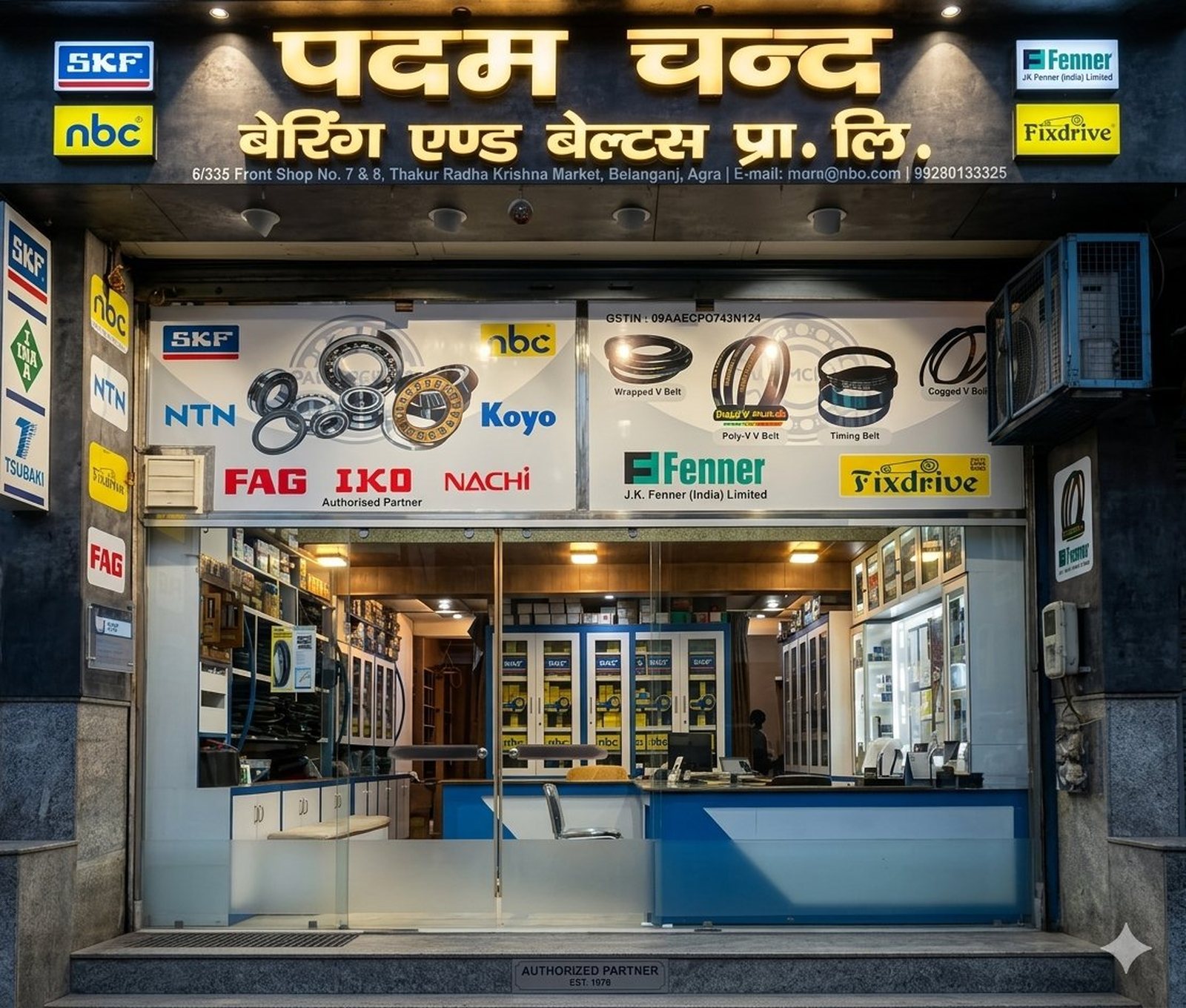 Padam Chand Bearing & Belts shopfront in Belanganj, Agra — Hindi signboard, address line, authorized SKF, NBC, NTN, Koyo, FAG, IKO, Nachi, Tsubaki, JK Fenner and Fixdrive brand displays, doorway with bearing cabinets visible inside, AUTHORIZED PARTNER EST. 1978 plaque